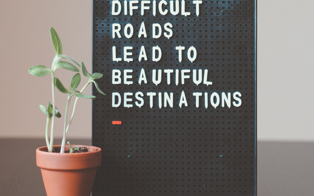 Sign that says Difficult Roads Lead To Beautiful Destinations